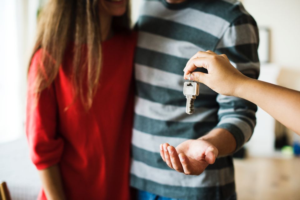 Couple receiving house keys.
