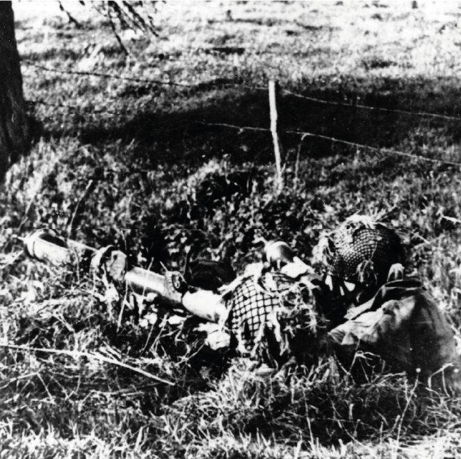 A Polish paratrooper in position with a PIAT (a portable anti-tank weapon). Location of photo unknown.