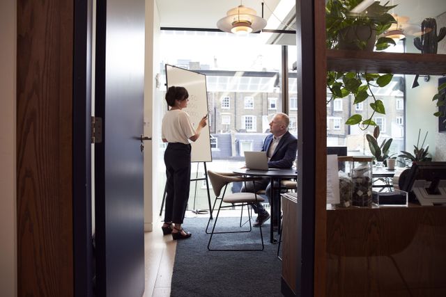 Man and women talking in an office